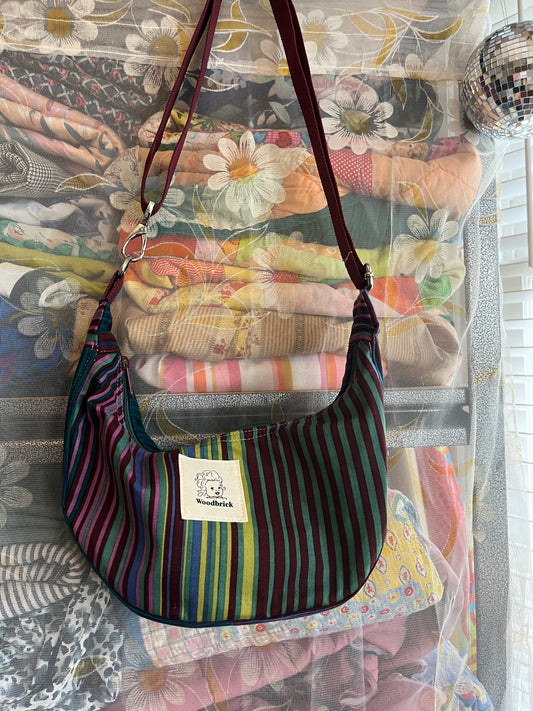 "False Promise" Sidekick Crescent Bag